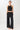 Mandala Fitness Top Schwarz Outfit Front - Cross Top
